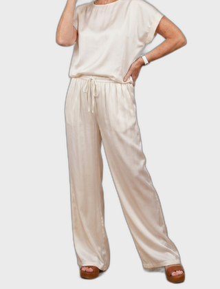 White satin lounge set with short-sleeve top and drawstring wide-leg pants