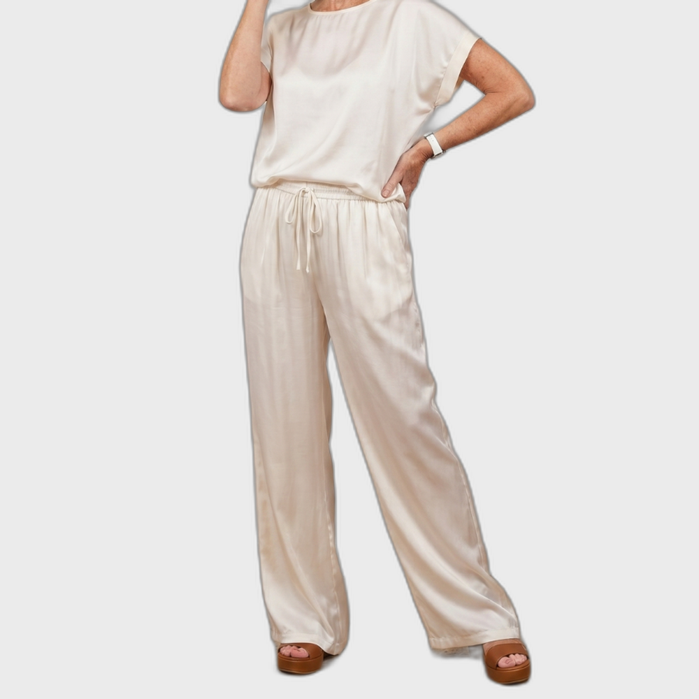 White satin lounge set with short-sleeve top and drawstring wide-leg pants