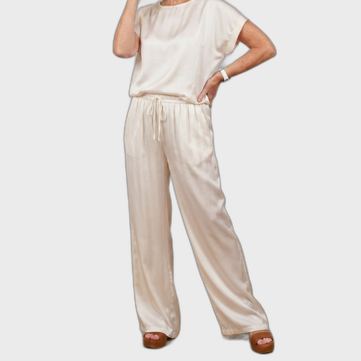 White satin lounge set with short-sleeve top and drawstring wide-leg pants