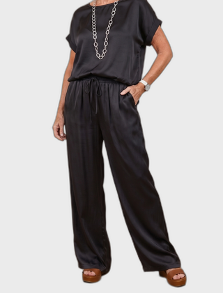 Black satin lounge set with short-sleeve top and drawstring wide-leg pants