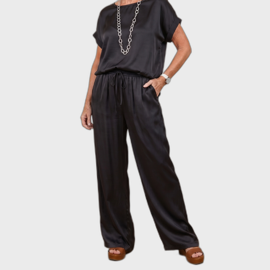 Black satin lounge set with short-sleeve top and drawstring wide-leg pants