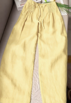 Yellow wide-leg trousers with drawstring waist and relaxed, straight legs