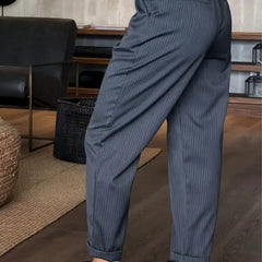 Sleek tailored pants in dark blue pinstripe, front slant pockets, belt loops, cuffed hem