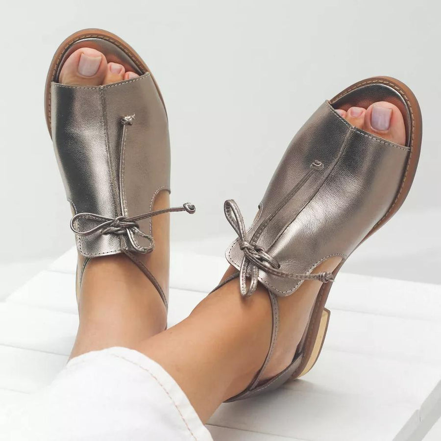 Bronze leather strap-style sandals with ankle lace-up and open toe design