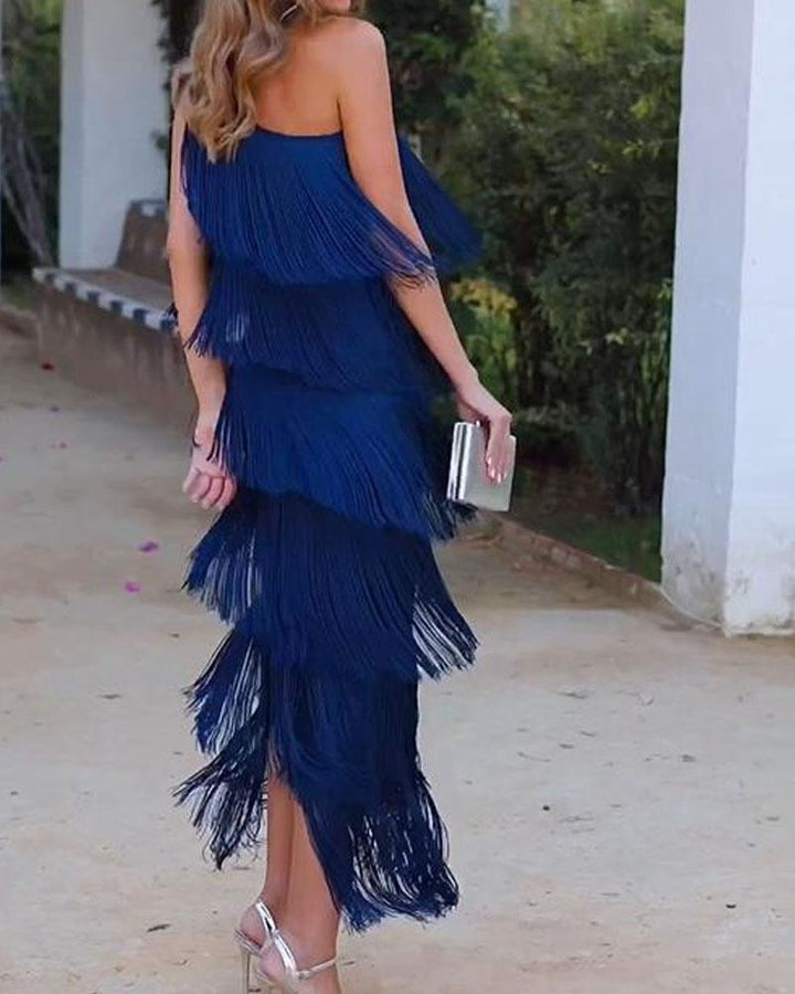 Off-shoulder tiered fringe maxi dress in royal blue, side view with layered tassels