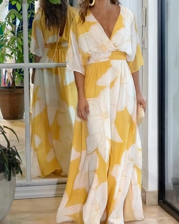 Yellow and white floral print maxi dress with V-neck and three-quarter sleeves