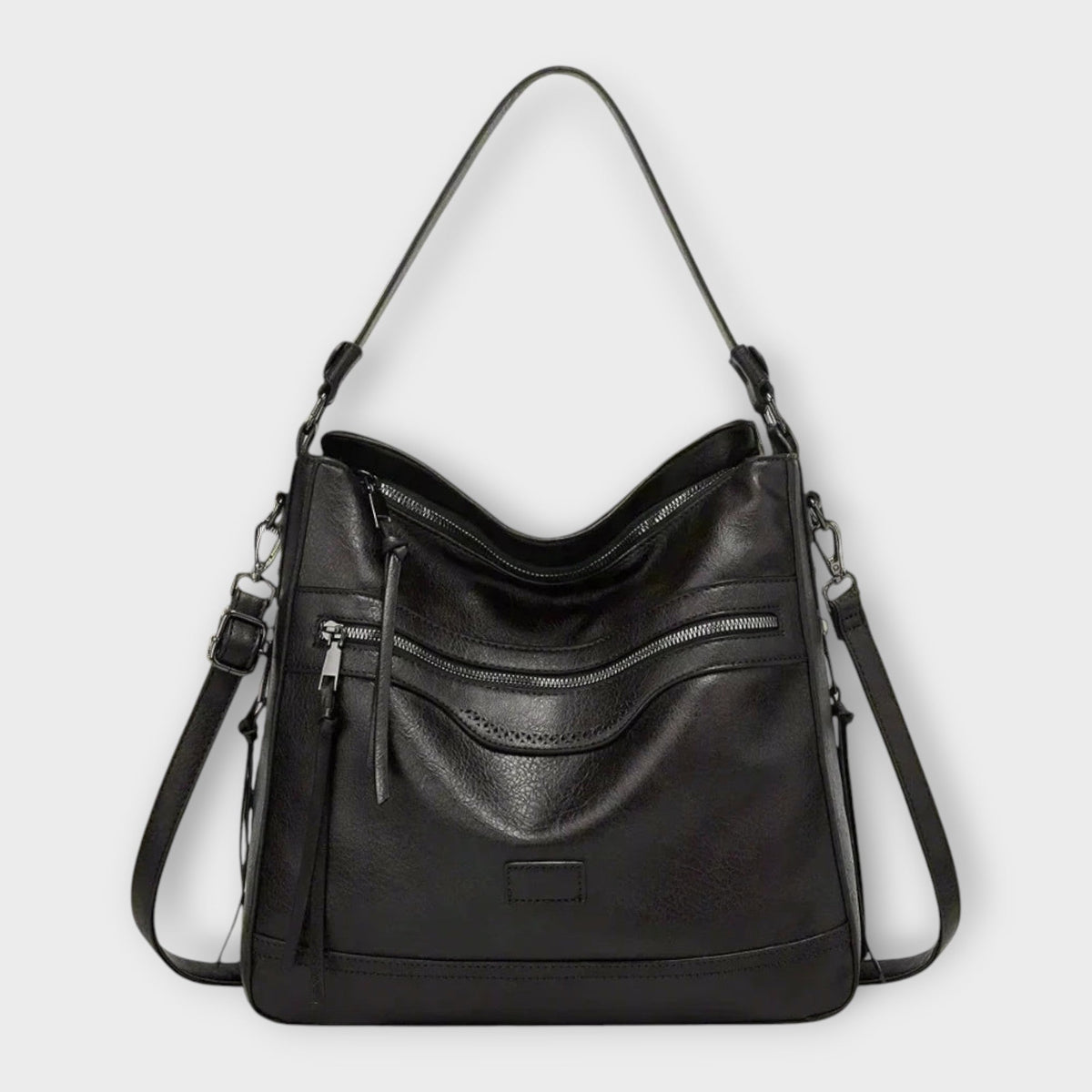 Black retro shoulder bag with front zip pockets and tassel detail