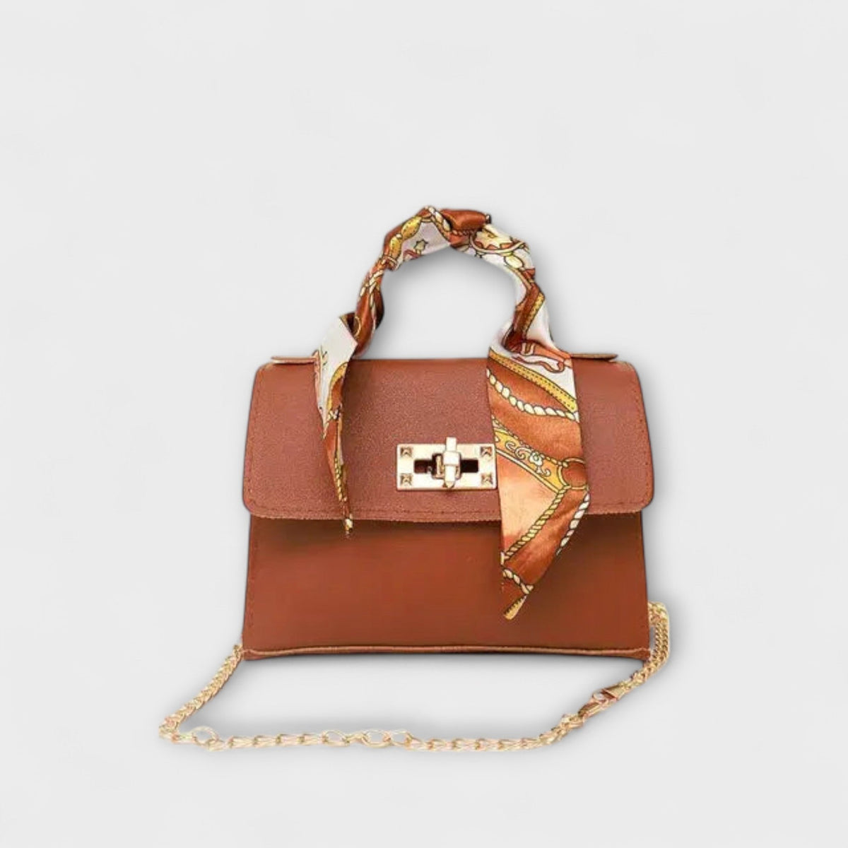 Light brown handbag with gold clasp, chain strap, and patterned scarf handle