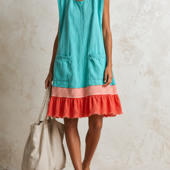 Teal sleeveless ruffle hem tunic dress with striped band and coral ruffle hem