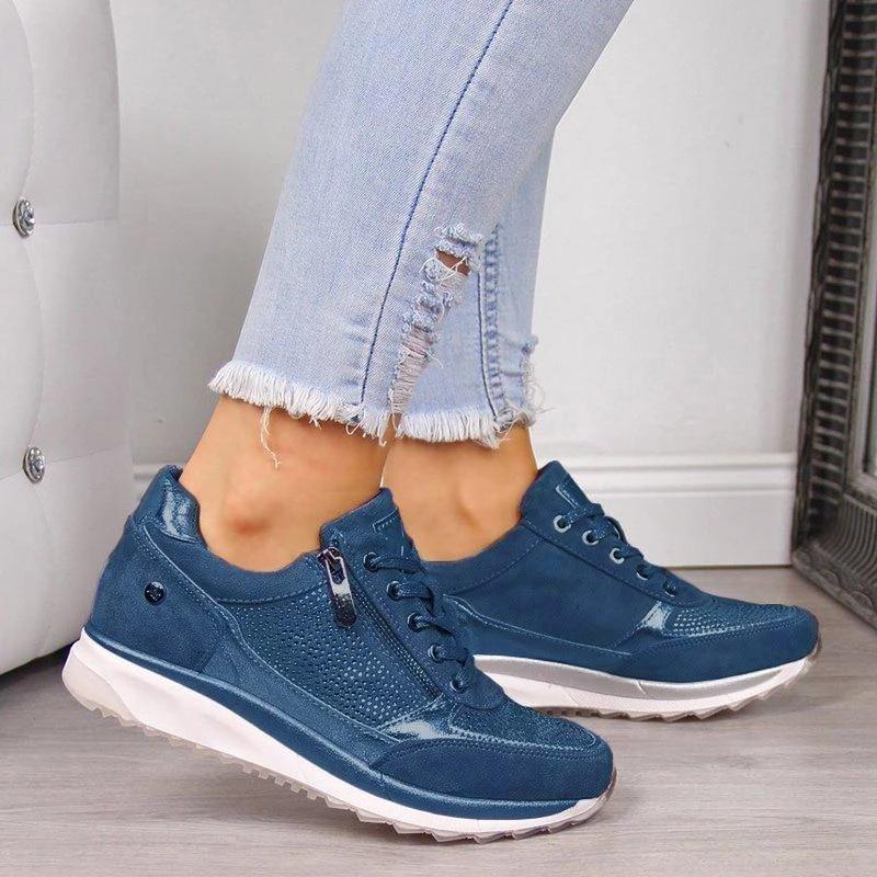 Blue orthopedic sneakers with side zipper, lace-up, and white cushioned sole