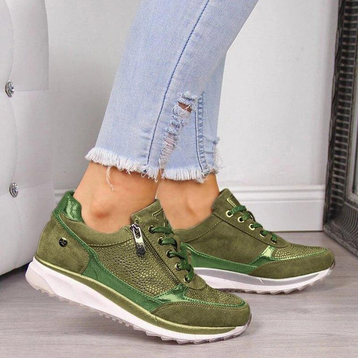 Green orthopedic sneakers with side zipper, lace-up, and white cushioned sole