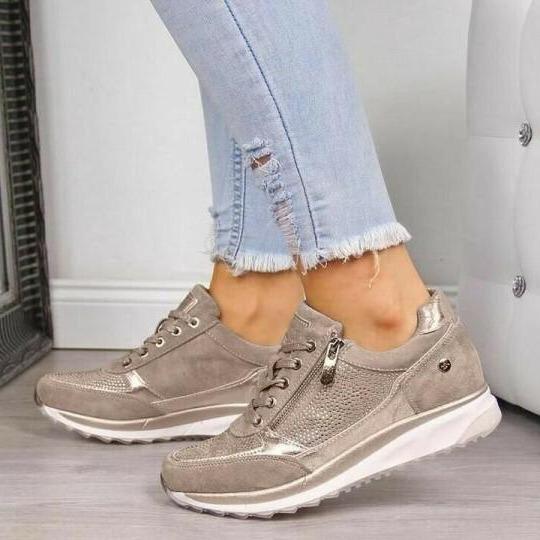 Beige orthopedic sneakers with side zipper, lace-up, and white cushioned sole