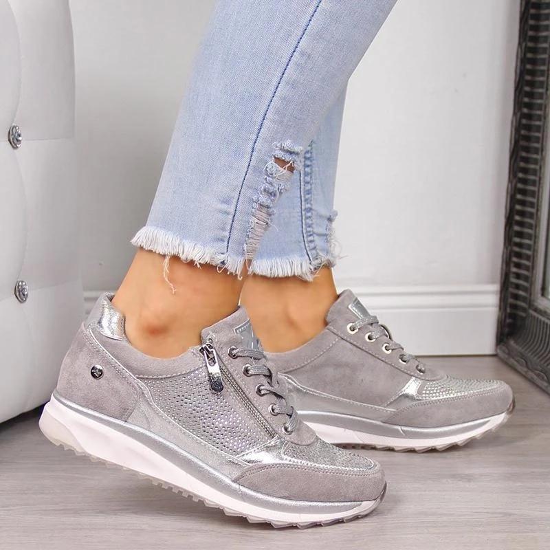 Silver orthopedic sneakers with side zipper, lace-up, and white cushioned sole