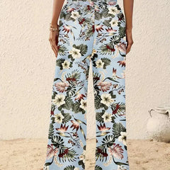 Light blue wide-leg trousers with scattered tropical flowers and foliage print