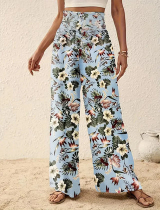Light blue floral wide-leg trousers with multicolor foliage and flower print