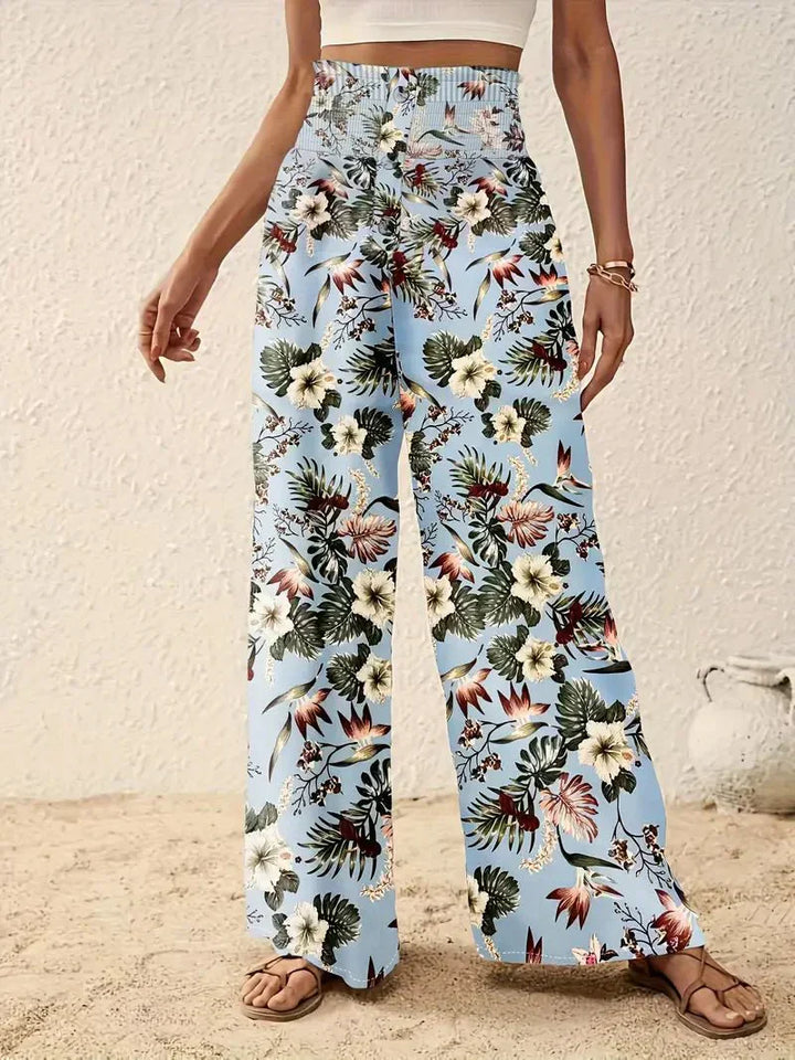 Light blue floral wide-leg trousers with multicolor foliage and flower print
