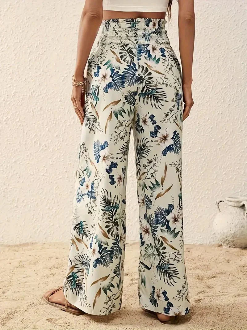 Cream floral wide-leg trousers with blue-green garden leaves and blooms