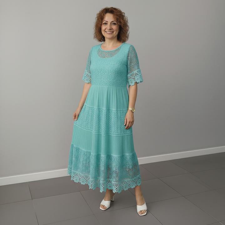 Teal lace midi dress with short lace sleeves and tiered skirt detail