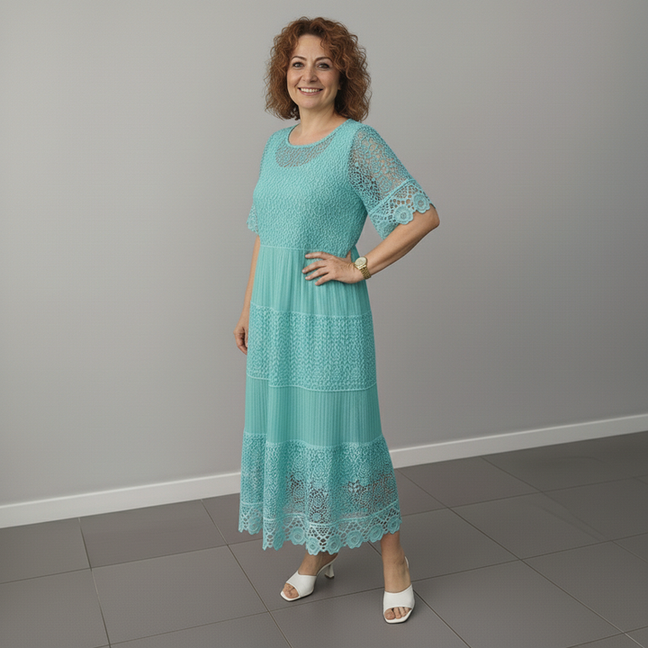 Teal lace midi dress, short lace sleeves and layered tiers at the skirt