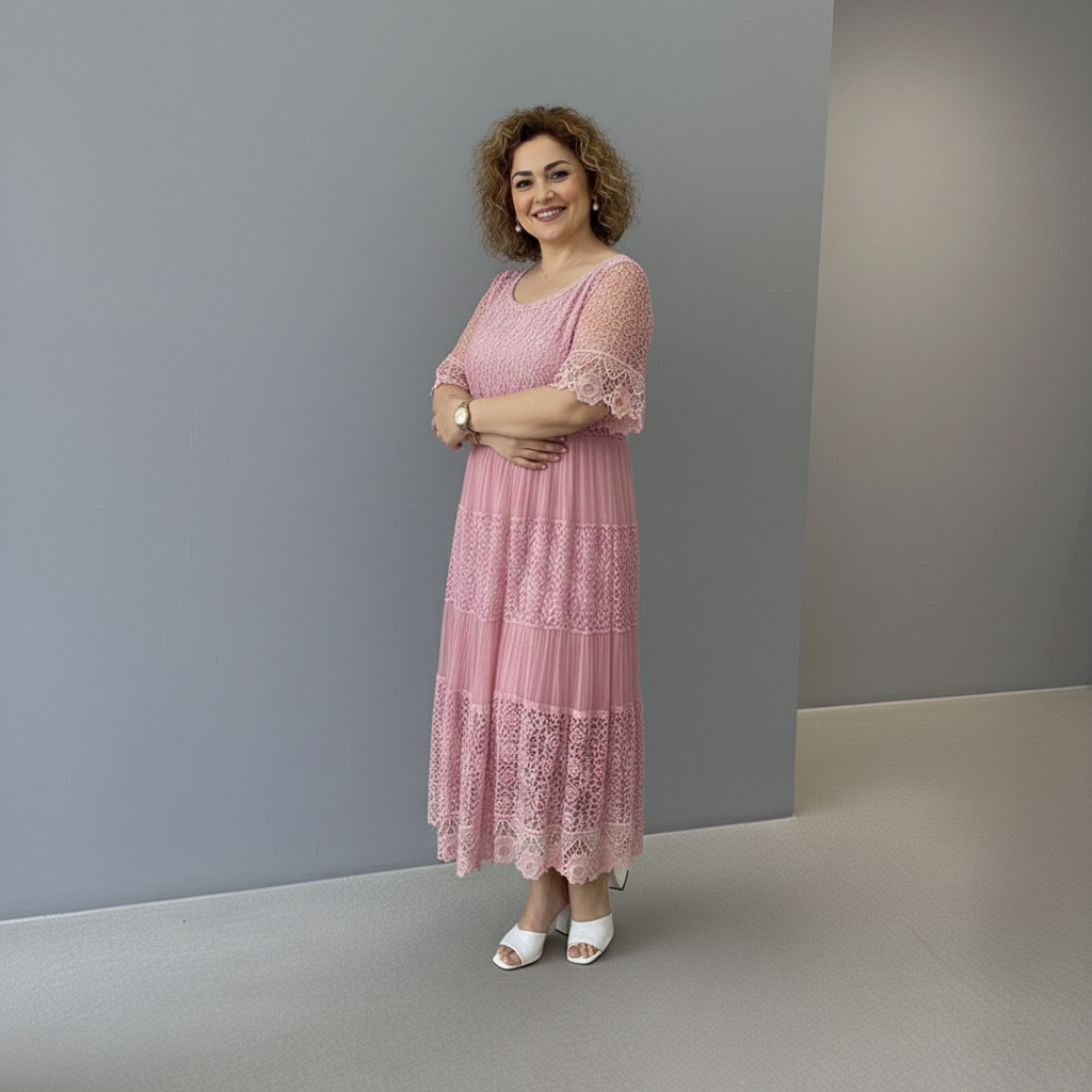 Dusty pink lace midi dress with lace sleeves and patchwork-style tiered skirt
