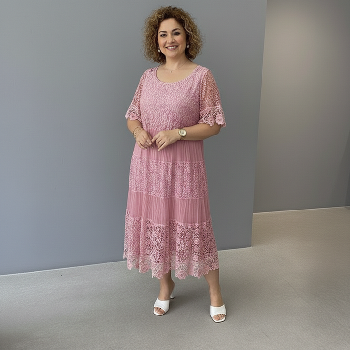 Dusty pink lace midi dress with round neckline and tiered lace panels