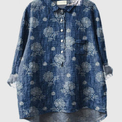 Embroidered denim-blue shirt with light floral vine designs, button-up front and patch pocket
