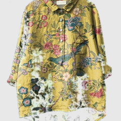 Embroidered floral shirt in yellow with pink and blue blossoms, button-up front and pocket