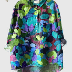 Embroidered leaf-pattern shirt in teal, green, and purple circles, button-up front and chest pocket