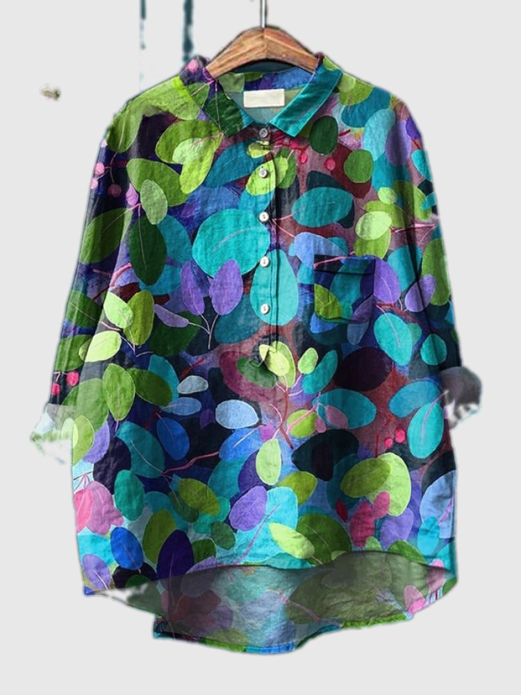 Embroidered leaf-pattern shirt in teal, green, and purple circles, button-up front and chest pocket