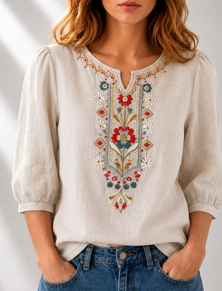 Beige embroidered floral blouse with puff sleeves and V-neck buttonless trim