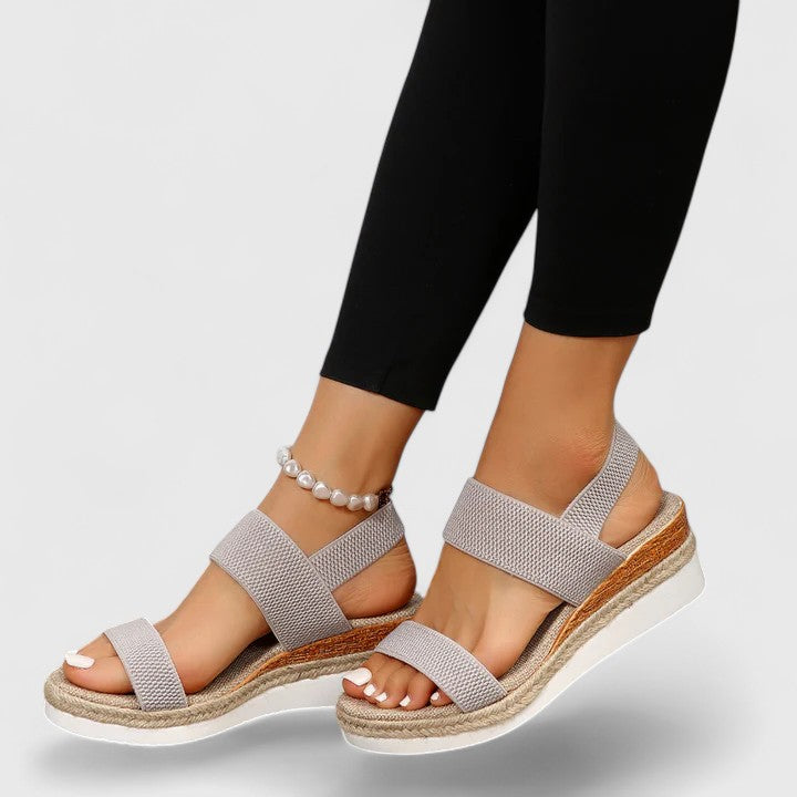 Orthopedic sandals in light gray with wide straps and cushioned wedge sole