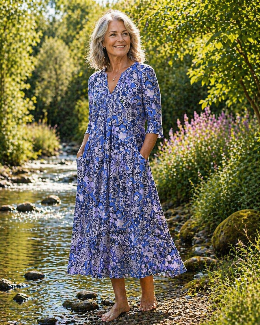 Blue patterned midi summer dress with V-neck and three-quarter sleeves