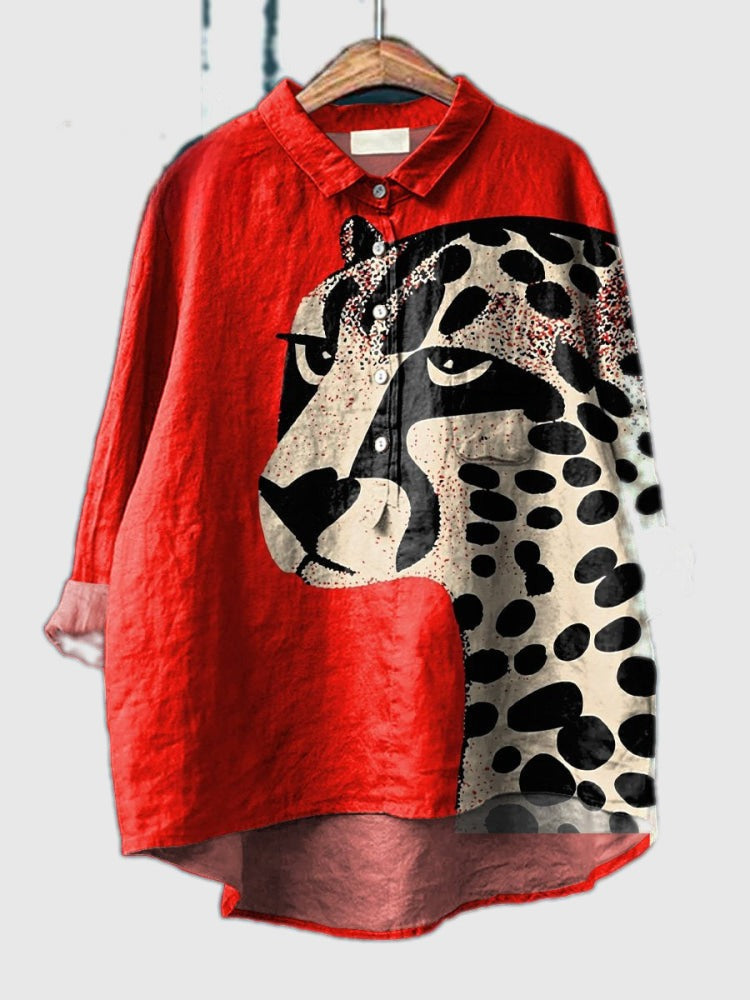 Red button-up shirt with black-and-white cheetah print panel, pointed collar