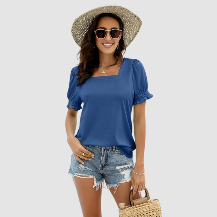 Blue square-neck blouse with short puff sleeves and gathered cuffs.