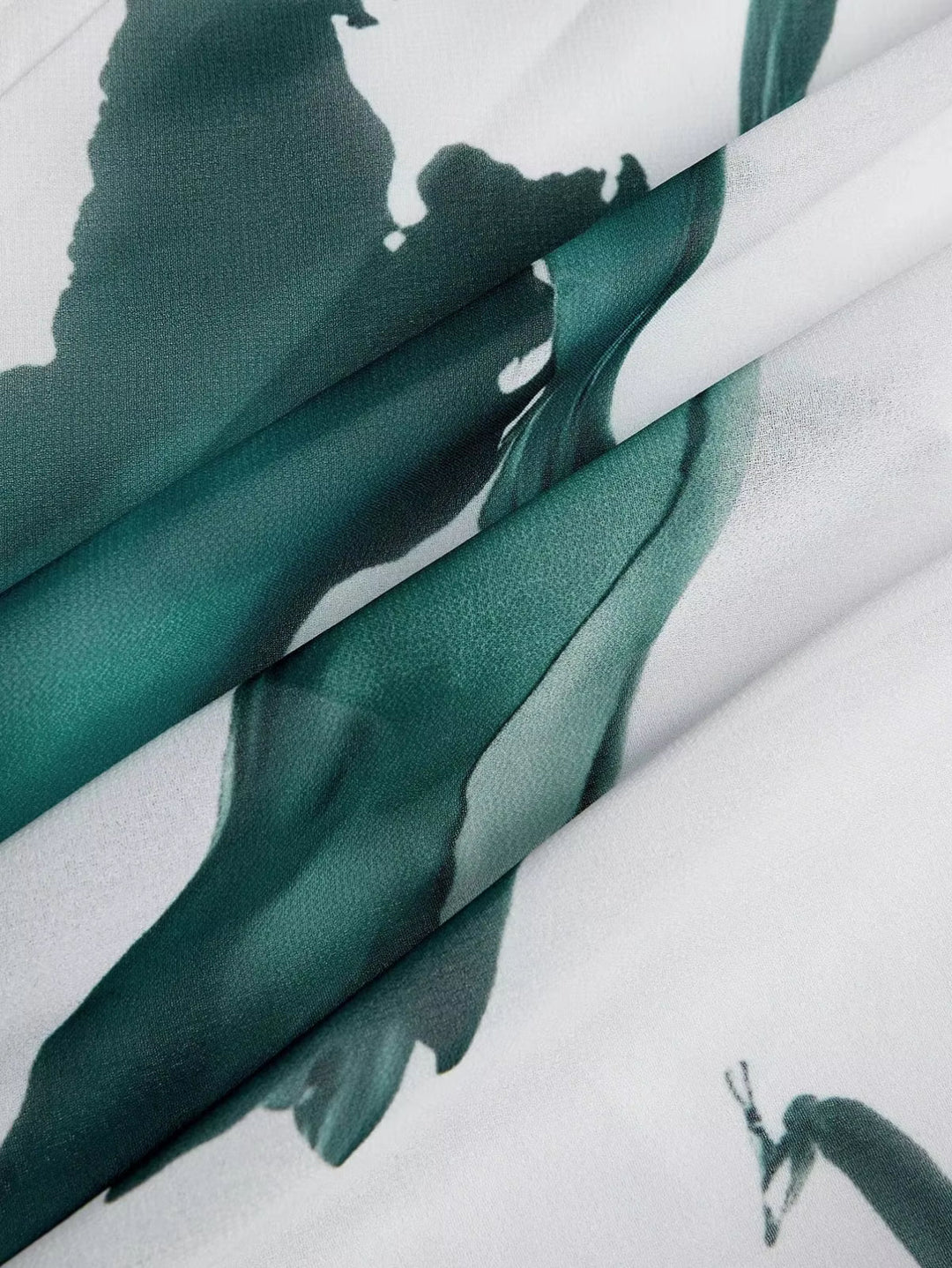 Teal and white watercolor fabric swatch with abstract botanical print