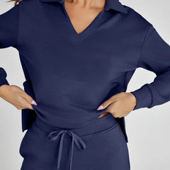 Navy V-neck long-sleeve top and drawstring waist pants, front close-up