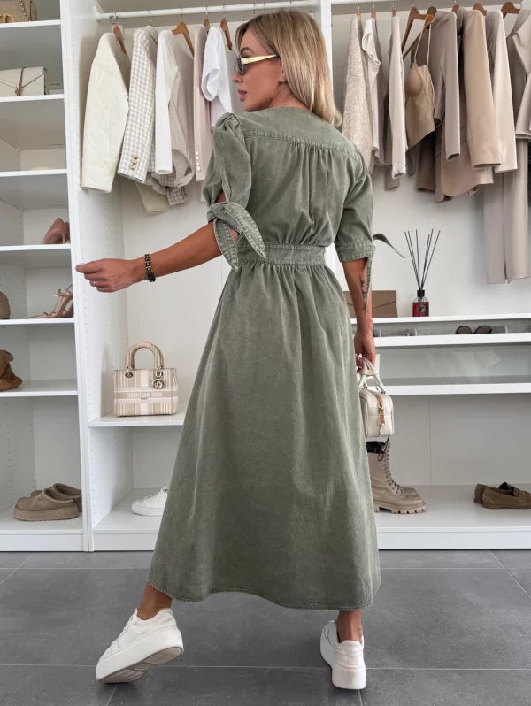Back view of olive green denim midi dress with gathered waist and button-front, short sleeves