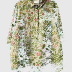 Beige floral forest button-up shirt with long sleeves, collared neckline, front buttons