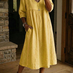Mustard yellow V-neck maxi dress with 3/4 sleeves and gathered bodice
