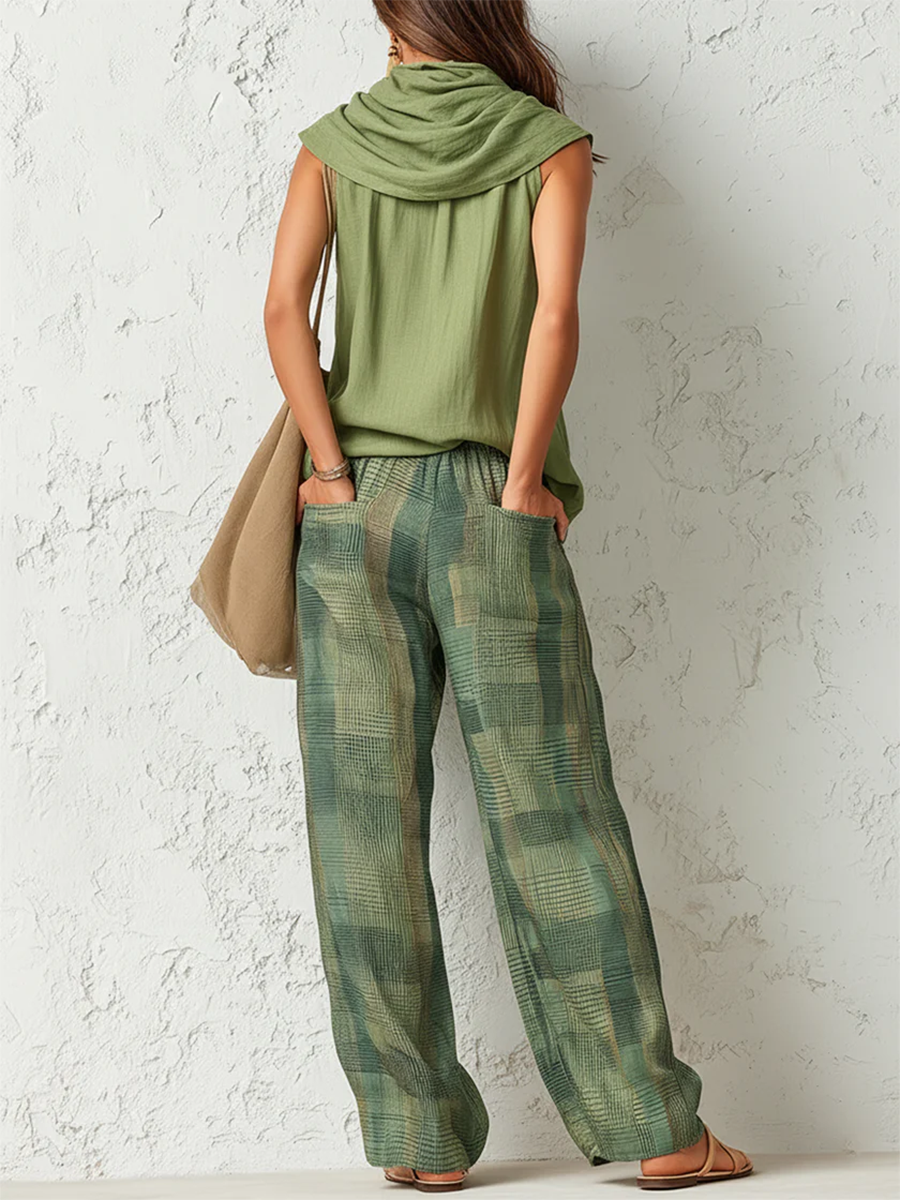Relaxed set back view: sleeveless draped cowl-neck top with plaid wide-leg pants