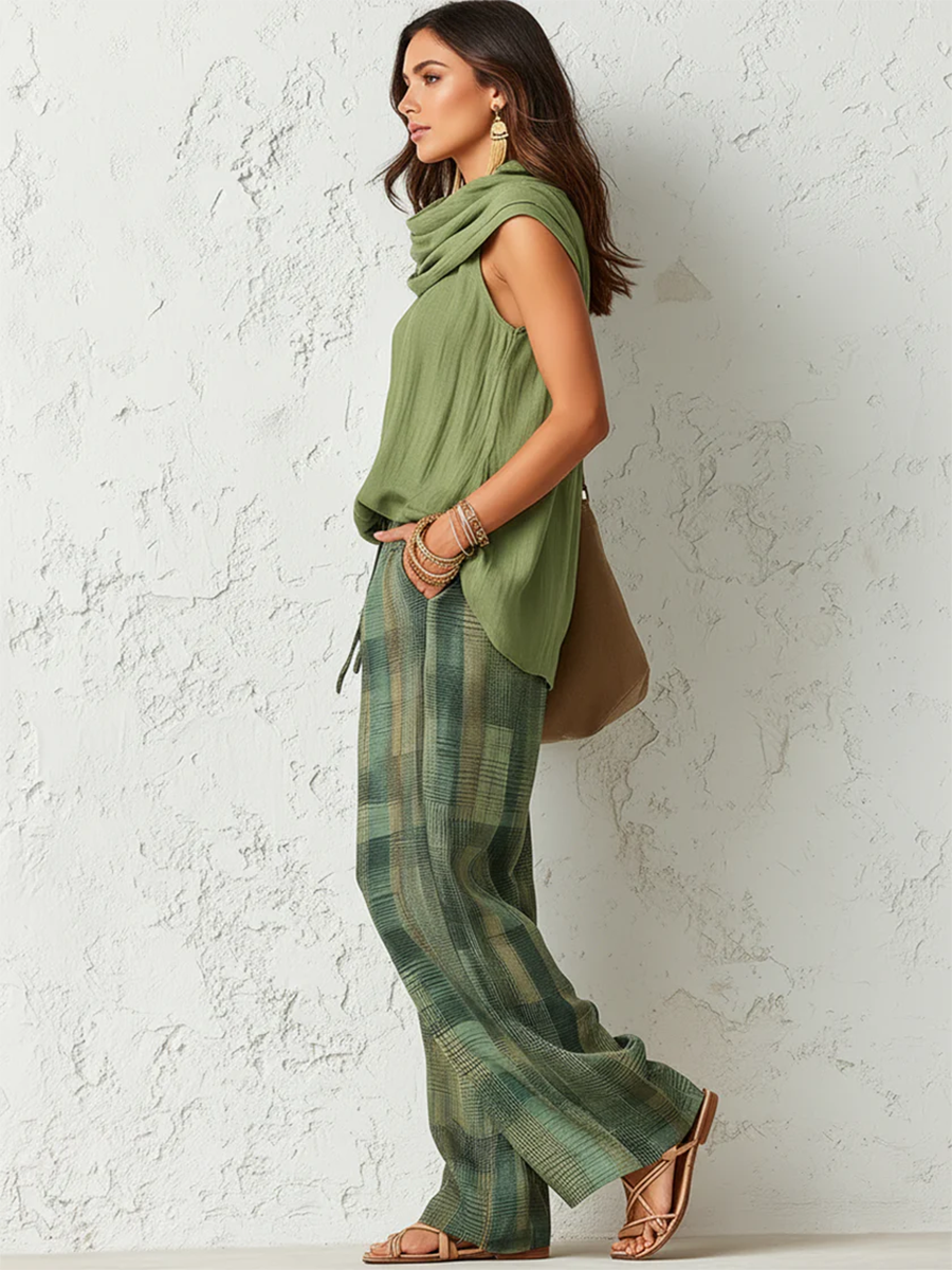Relaxed set side view: sage green sleeveless cowl-neck top and green plaid wide-leg pants