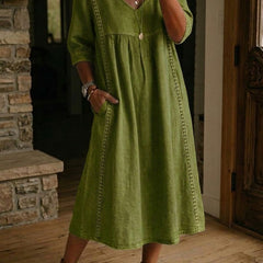 Olive green V-neck maxi dress with 3/4 sleeves and gathered bodice