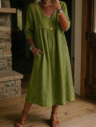 Olive green V-neck maxi dress with 3/4 sleeves and gathered bodice