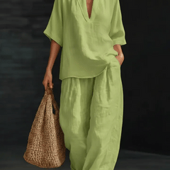 Green linen two-piece set with V-neck blouse top and relaxed wide-leg pants