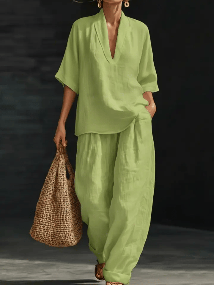 Green linen two-piece set with V-neck blouse top and relaxed wide-leg pants