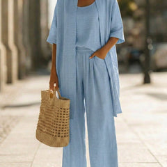 Light blue women's elegant set with scoop-neck top, wide-leg pants, and cardigan