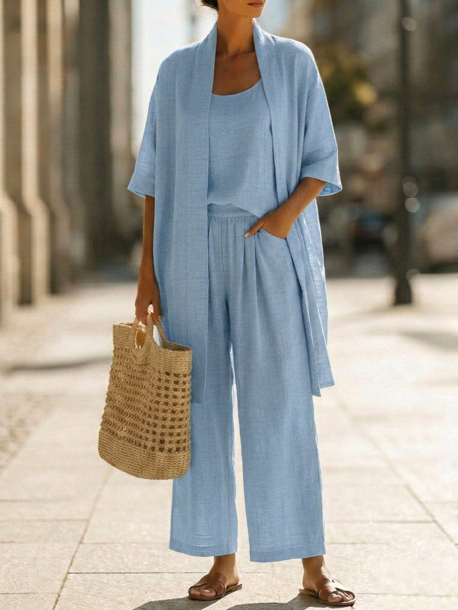 Light blue women's elegant set with scoop-neck top, wide-leg pants, and cardigan