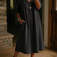 Black V-neck maxi dress with 3/4 sleeves and gathered bodice