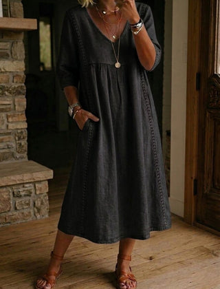 Black V-neck maxi dress with 3/4 sleeves and gathered bodice