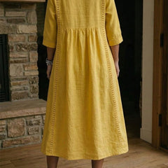 Yellow maxi dress back view with 3/4 sleeves and gathered skirt
